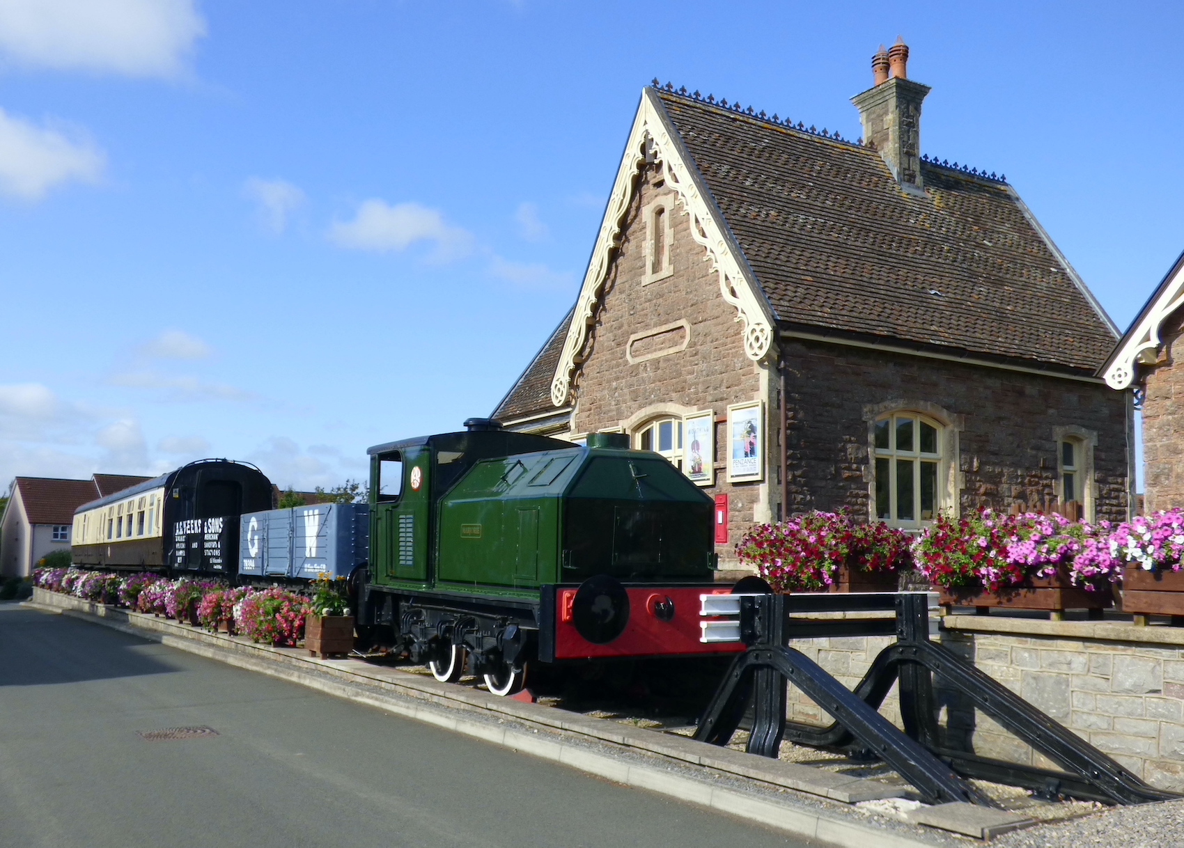The Sentinel shunter, trucks and BR Mk1 coach in front of the station building
